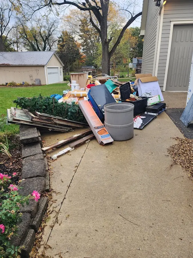 Dumpster being loaded with debris for Demolition Dumpster Rental in Sleepy Hollow